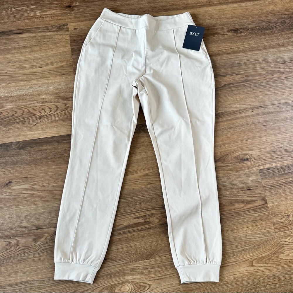 BYLT Womens Elite+ Pintuck Jogger Pants Ivory Large Stretch Pockets Travel‎ NWT